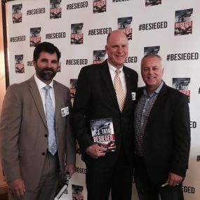 NC Heroes Fund Board Members Glen Blumhardt and David Hayden attend NC Heroes Fund Board of Advisors Chair, Tony Tata's book signing for Besieged. Tony auctions off a character in each of his books to benefit the NC Heroes Fund.